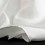 <p>L’habotai és un teixit llis, sense relleu d’uns 30/35 grams metre quadrat, molt suau al tacte, més gruixut que els ponge però amb les mateixes característiques  molt indicat per la pintura en seda. Els mocadors, en blanc natural, tenen la vora feta a mà amb fil de seda.</p>